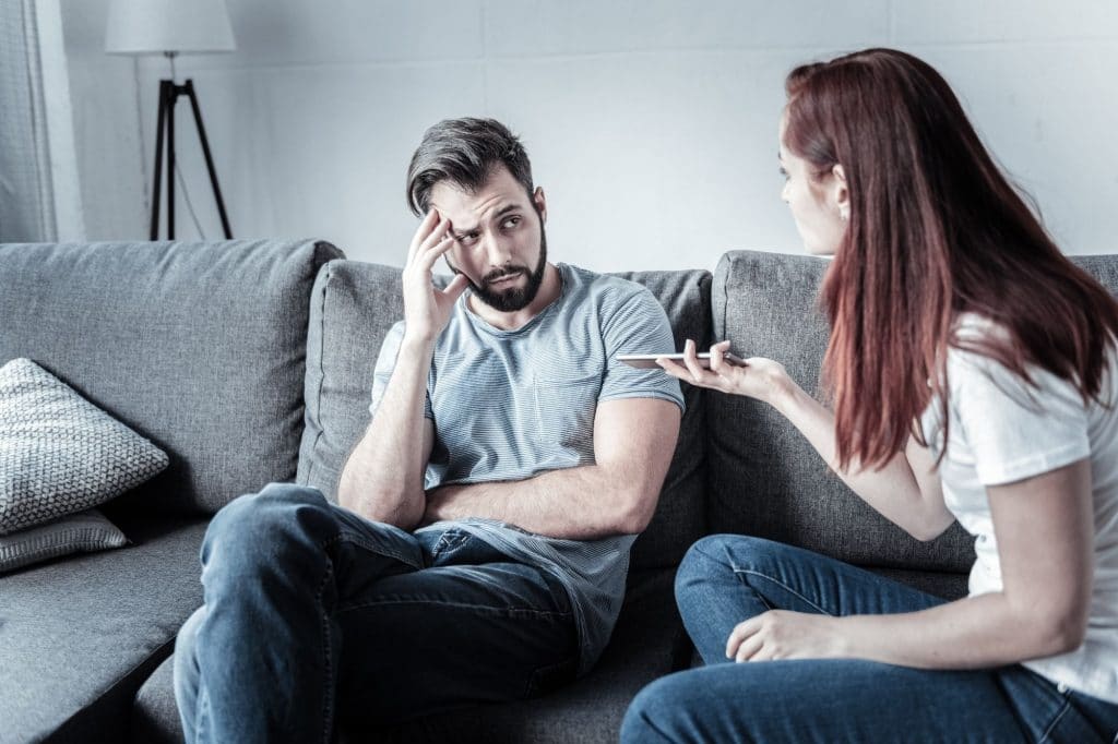 couple arguing on couch